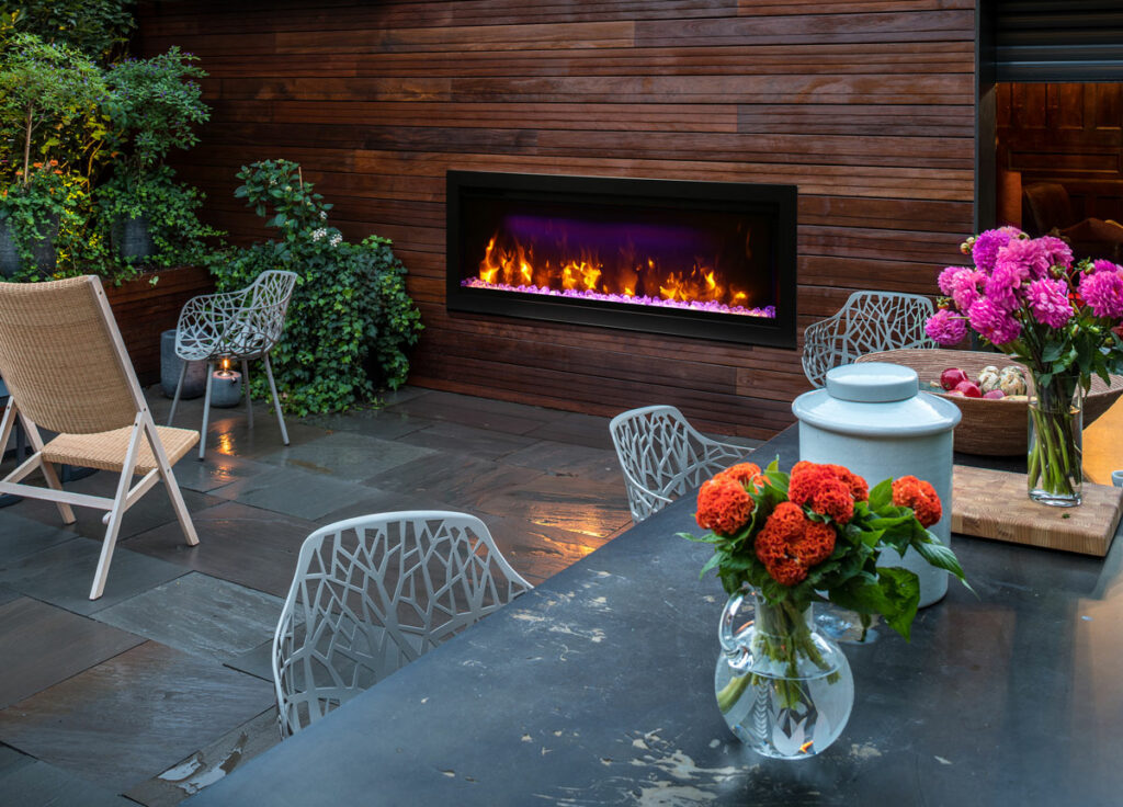 AMANTII SYM-42 INDOOR-OUTDOOR ELECTRIC FIREPLACE IN BACKYARD