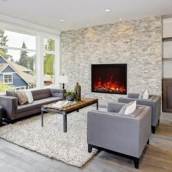 AMANTII TRD-48 ELECTRIC INSERT IN STACKED STONE WALL LIVING ROOM